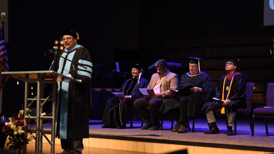 Dr. Saggio speaks during AIC's commencement ceremony